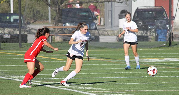 A Raider has an inside track on a loose ball during Wellesley’s 3-0 loss to Natick. Photos by Michael Flanagan