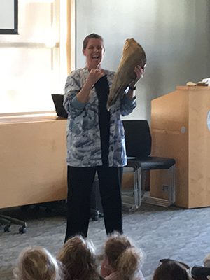 Cynde McInnis, creator of the Whalemobile, demonstrates what baleen is by holding a group of plates. Photos by Katrina Margolis