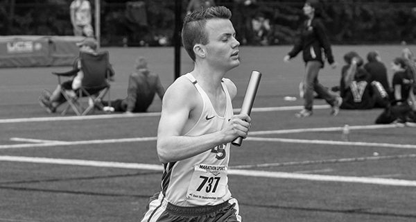 Owen Searle races towards a third-place finish in the 4x800 relay at the Division IV championships. Photos by Maura Bennett