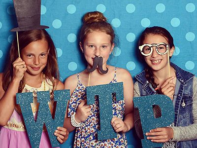 From left to right: Students Kate Morrow Bebe Cloaninger, and Payton Defina pose in the photo booth.  Photos by John Harmon of Sandy Sandwich Productions 