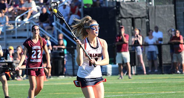 Junior Emily Curtis (14) rushes in and gets ready to deposit the third of her three goals on the afternoon against Groton-Dunstable late in the first half. Photos by Michael Flanagan