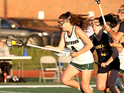 Pictured during Westwood’s South Sectional semifinal match with NDA (Hingham), Haley Connaughton (4) was named TVL MVP, Boston Globe All-Scholastic, and a TVL All-Star after a dominant senior season in 2017. Photos by Michael Mao