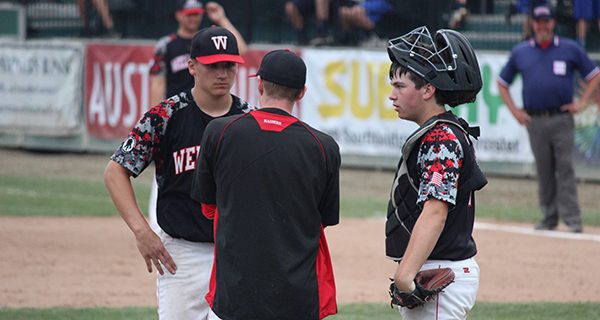 Henry Weycker, who took home Third-Team All-State honors, and head coach Rob Kane, who was awarded Division I Coach of the Year, chat on the mound during Wellesley’s state championship match against Taconic on June 17. Photos by Michael Flanagan