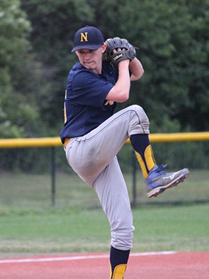 Jake Dateo (15) gets set to fire in a pitch while closing the game out for Needham in the bottom of the tenth.