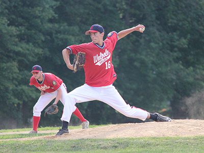 Ryan Murphy (16) fires in a strike in the top of the first inning of Thursday night’s 4-3 win over Medfield.