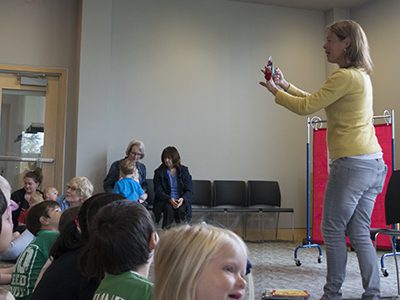 Suzie Canale, a staff member at Westwood Library, begins her segment of ‘Wiggle and Giggle Storytime’ with a rhyme called ‘The Five Little Clowns’ involving clown finger puppets and counting. Pictures by Christina Perrone