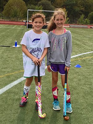 Ella Swenson (left) and Kaitlyn Uller (right), daughters of Wellesley Scoops founders Meghan Swenson and Kelly Uller, pose together after a long day of getting better during last year’s Wellesley Scoops development clinic. Photos by Kelly Uller