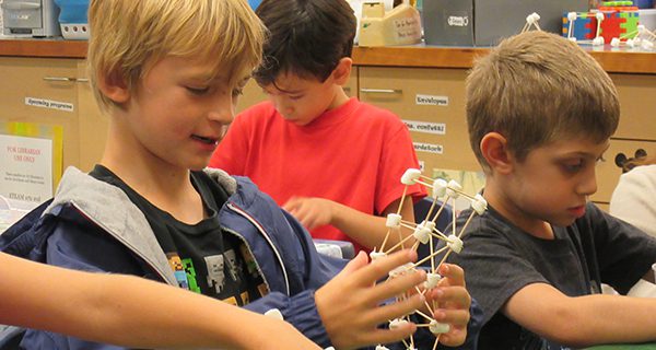 While finishing up his structure, one child had the idea of using a square base. Photos by Gabe Stern