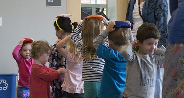 In keeping with the theme of the day’s circus theme, children walk across a line of tape while balancing a beanbag on their heads - good imagination practice. Pictures by Christina Perrone
