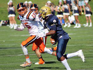 Sophomore wideout Odahri Hibberts (3) cuts up field on a sweep play during the second half of Saturday’s match with Newton North.
