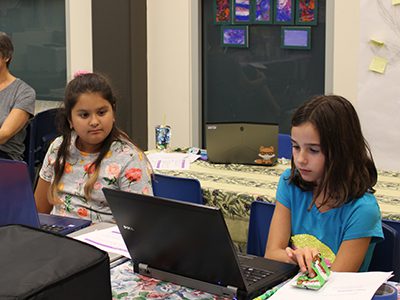 Aspiring computer scientists meet for the first session of Girls Who Code, a coding club held at the Needham Free Public Library. Photos by Laura Drinan