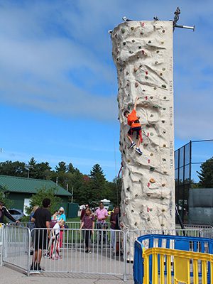 Ten-year-old Colin Greally aims for the top of Westwood Day’s rock-climbing tower – just one of the many activities available for children at the festival.