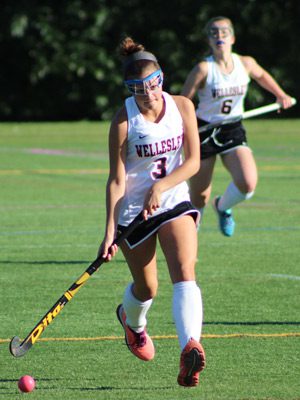 Kayla Johnson (3) pushes the ball up the field for Wellesley midway through the first half of Tuesday’s 1-1 tie with Walpole.