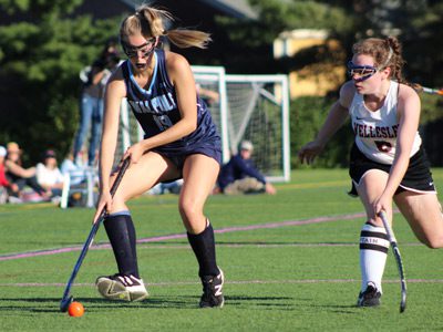 Wellesley’s Alex Ramsden (8) defends against Walpole’s Nicole Griffin (19) early in the second half.