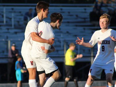 Ryan Clare (8) celebrates with brother Brendan Clare (9), and teams Daniel Frei (11) and Owen DeOliveria (6) following his go-ahead goal midway through the second half of Tuesday’s 4-3 win against Framingham.