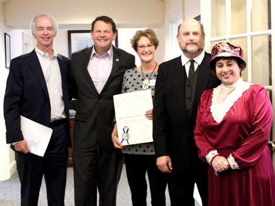 Left to right: Richard DeSorgher, Rep. Shawn Dooley, Kristen Chin, Steve Small (as Granville Dailey), and Cynthia Small (as May Belle Dailey), celebrate the library’s one hundred years with a resolution from the Commonwealth of Massachusetts.