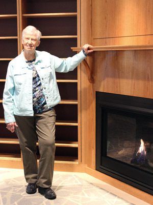Mary Bowers stands in the café named in her honor in the new Wellesley senior center, the Tolles Parsons Center.