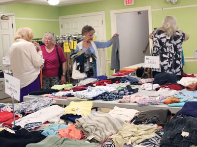 Every Wednesday, shoppers come to the Unitarian Universalist Area Church for the Good As New Shop to find brand name clothes at bargain prices.