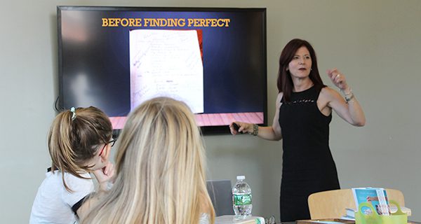Elly Swartz, a realistic fiction author, shows a group of her readers the possible titles for her novel before she came up with the name “Finding Perfect.”