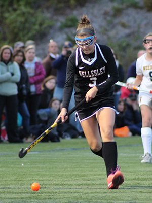 Kayla Johnston (3) moves the ball up the field for Wellesley midway through the second half. Photos by Michael Flanagan