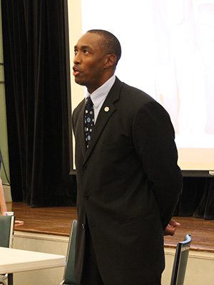 Sean Ellis, a former Needham student, speaks about the 21 years he spent in prison for a crime he did not commit. Photos by Laura Drinan