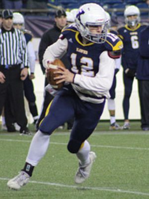 Xaverian quarterback Davin Sweeney (12) rolls out on a bootleg late in the second quarter. Photos by Michael Flanagan