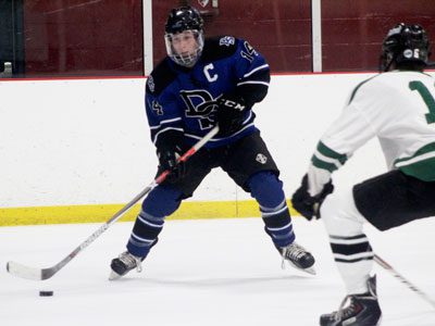 Senior captain and forward Cole Condon (14) attempts to thread a seed into the middle on an odd-man rush for DS late in the first period.