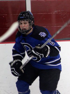 Tommy Higgins (8) who scored his first-ever varsity goal during Monday’s 2-1 win over Westwood, races in on the fore-check midway through the first period.