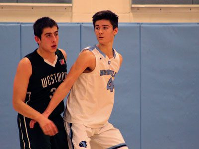 Medfield guard Stephen Williams (4) gets ready to slip off a screen midway through the third quarter.