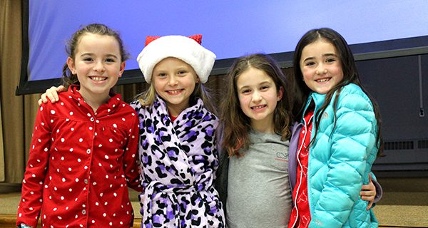 Third graders at OPR enjoy the sing-along with friends in their comfiest winter pajamas. Photos by Laura Drinan