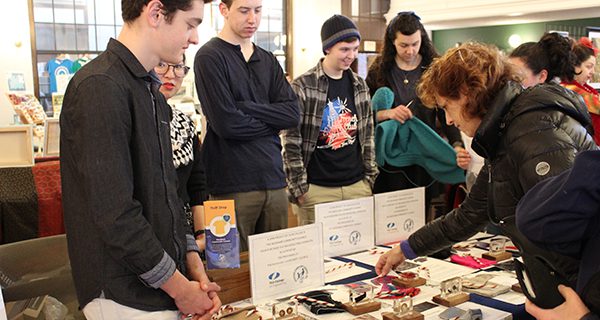 Members of the community take an interest in Olin College students’ classwork on bringing awareness to the global apparel industry’s wastefulness.