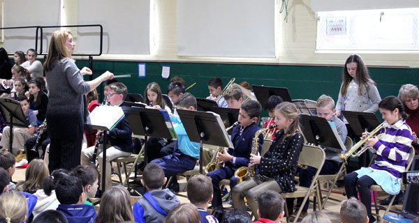 Lori Labedz conducts the fifth grade band’s performance at the Deerfield School winter concert. Photos by Laura Drinan