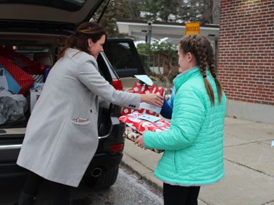 OPR students helped load the cars of DCF staff with present for the Snowman Project’s children in need.