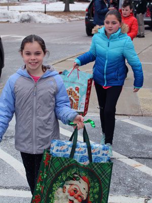 After collecting gifts for children in need, OPR students help deliver presents to the DCF’s Snowman Project.