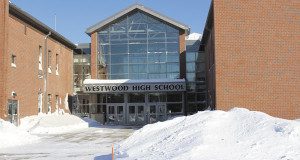 A mountain of snow greets Westwood High School students for their return from two snow days after the bomb cyclone.