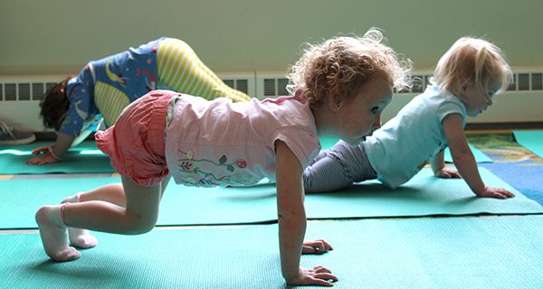 Medfield’s youngest yogis head to the Medfield Public Library for a yoga and literacy development class. Photos by Laura Drinan