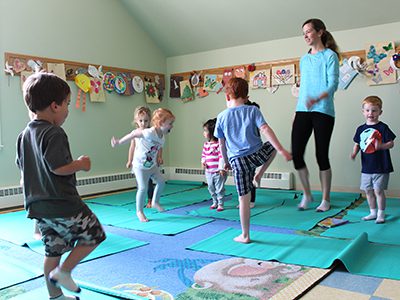 Children practice their strength, balance, and flexibility at the Medfield Library’s yoga class. Photos by Laura Drinan
