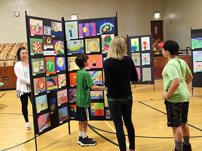 Students and parents admire the art done by Dale Street’s fourth and fifth graders. Photos by Laura Drinan