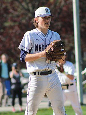 Needham starter Tom Chmielewski (pictured) stares down a runner leading off first during Wednesday’s grudge match with Wellesley. Photos by Michael Flanagan
