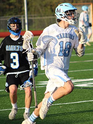 Trevor Ruzzo (18) rushes the ball up the field and leaves a DS defender in the dust late in the first quarter. Photos by Michael Flanagan