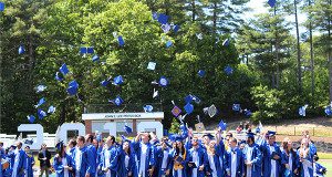 Walpole High graduates toss their caps in the air, celebrating their achievements and success at the high school. Photos by Laura Drinan