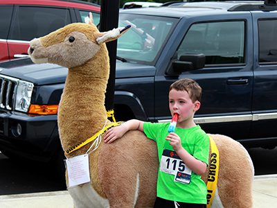 There’s nothing like a popsicle with your buddy, Dosie Doe, after a mile run. Photos by Daniel Curtin