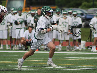 Junior fogo Kevin Lyons (12) sprints in with possession following a faceoff victory midway through the first quarter. Photos by Michael Flanagan