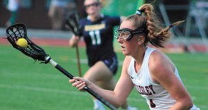 Sophomore Bridget Noonan (3) moves the ball up the field for Wellesley midway through the first half. Photos by Michael Flanagan