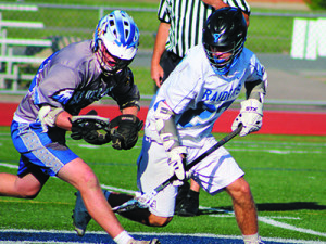Junior fogo Matt Paolatto (23) does battle for a faceoff early in the third quarter. Photos by Michael Flanagan
