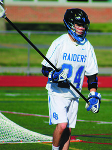 Senior close D Kyle McPherson (24) defends his cage on the man-down late in the third quarter. Photos by Michael Flanagan