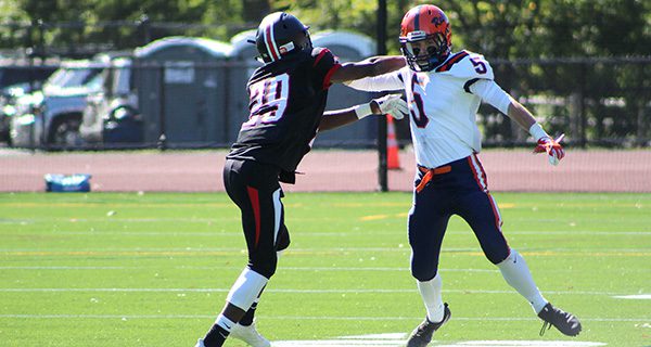 Walpole wideout Andrew White (5) becomes acquainted with a Wellesley corner in a 2017 game. White is one of several key players returning to this year’s team. Photos by Michael Flanagan