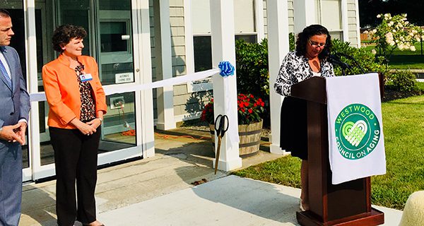 Paul McMurtry and Cynthia Peterson look on as Lina Arena-DeRosa addresses the assembled. Photos by Maria Makredes