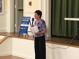 Great Plain Squares President Ruth Orenstein welcomes new members to the group’ annual square-dance event.