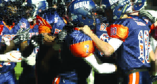 Walpole running back Chris Reilly (7), quarterback Will Jarvis (10) and teammates celebrate a second quarter touchdown run during the Rebels 56-21 win over Needham on Friday night. Photos by Michael Flanagan